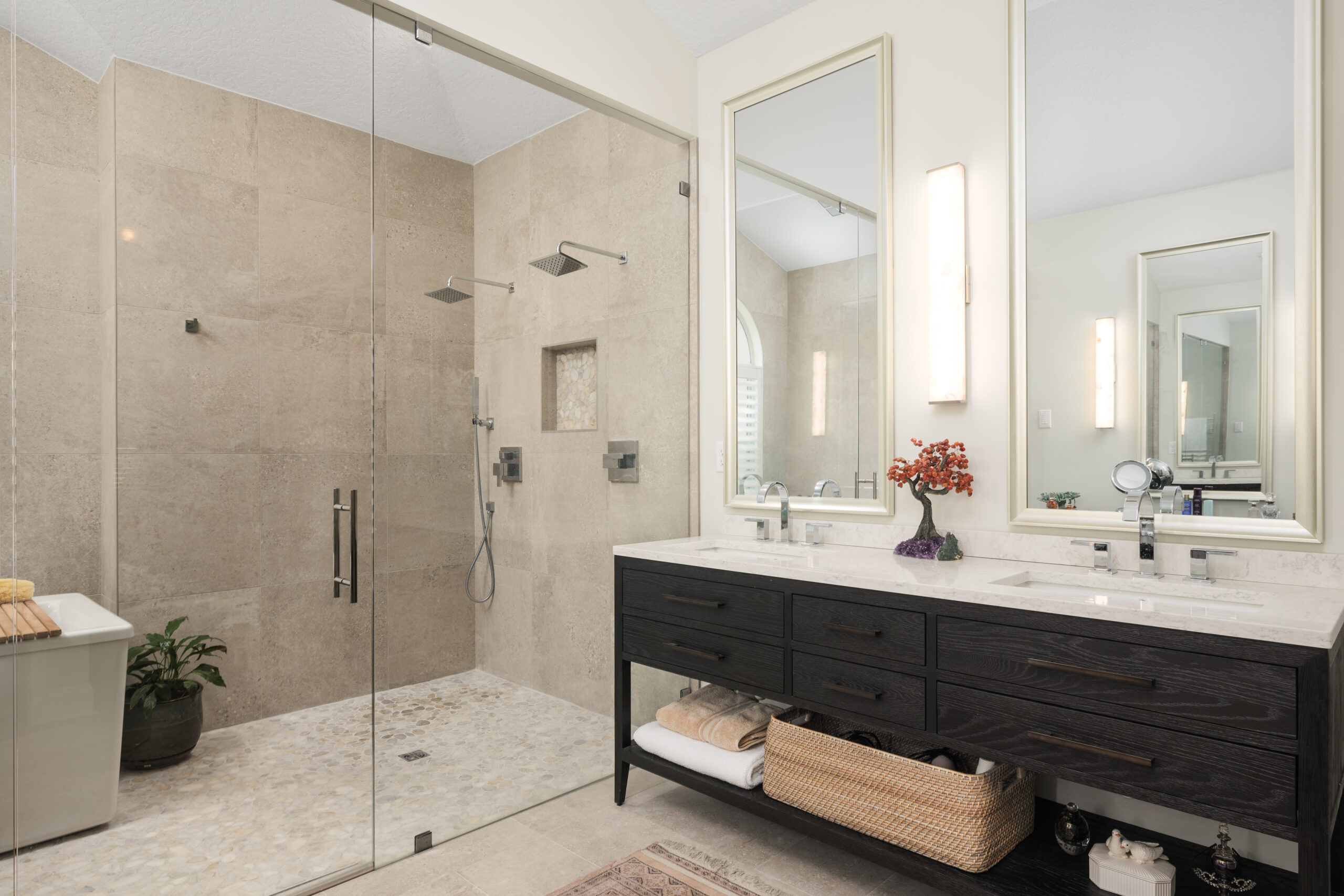 Double sink vanity with view of double head shower